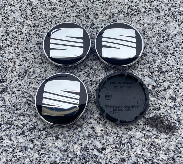 Tapabujes Seat 56mm Negro Plata Nuevos