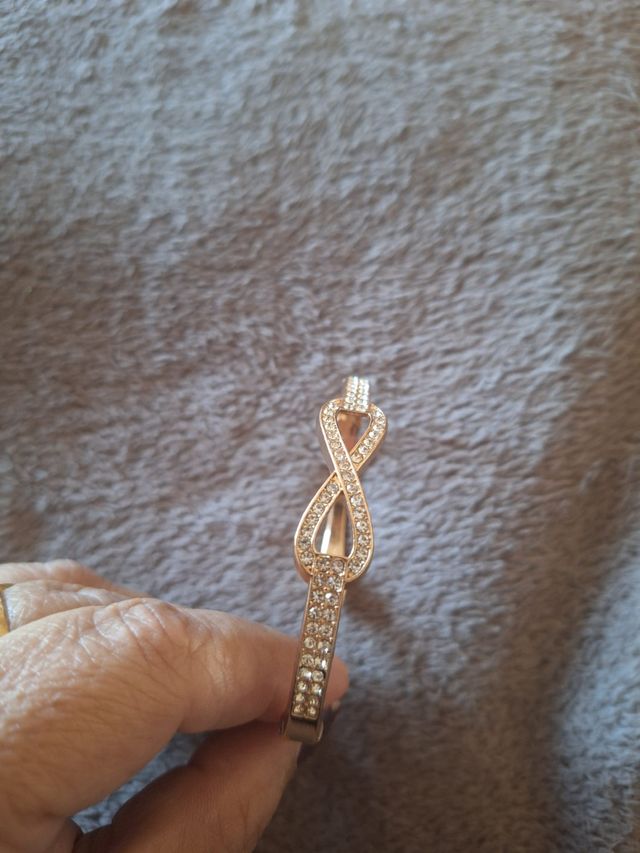 Pulsera caña infinito dorada acero