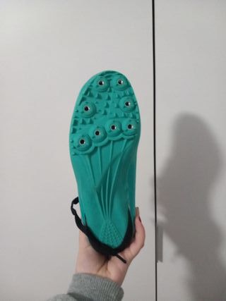 Zapatillas de atletismo color turquesa y dorado