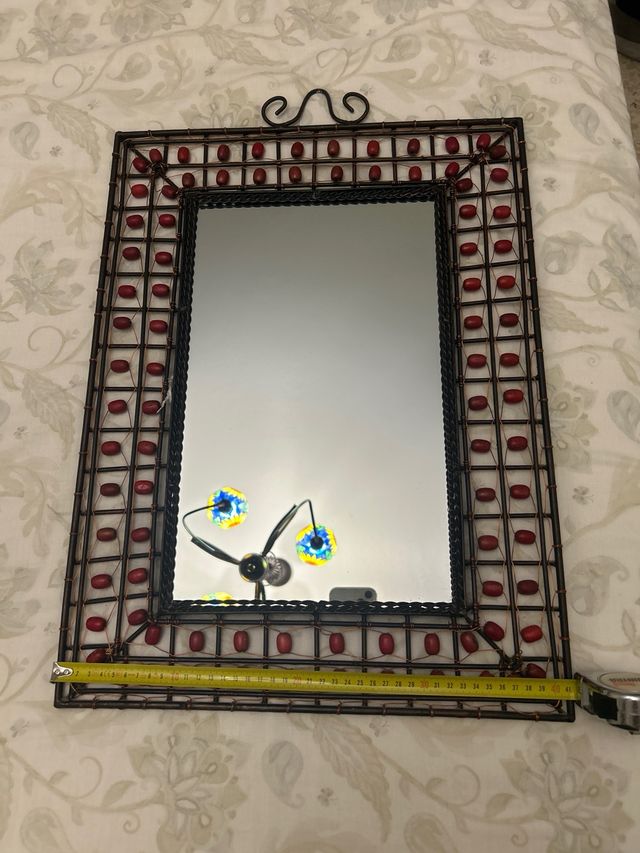 Specchio decorativo in ferro battuto