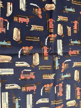 Tela de máquinas de trenes en fondo azul marino.