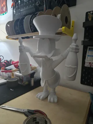 Statuetta Paperone con cappello e bottiglie 40 cm