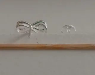 Pendientes infinito circonitas oro y plata