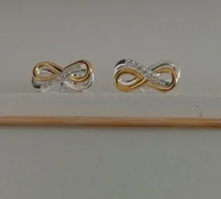 Pendientes infinito circonitas oro y plata