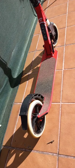 Patín Oxelo con freno y pata de cabra. Plegable.