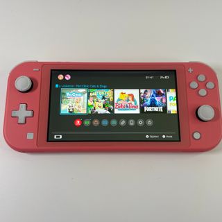 Nintendo Switch Lite Corallo con 6 Giochi