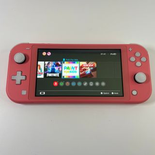 Nintendo Switch Lite Corallo con 6 Giochi