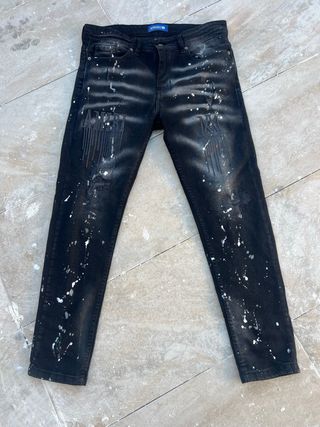 Vaqueros Amiri negros con salpicaduras