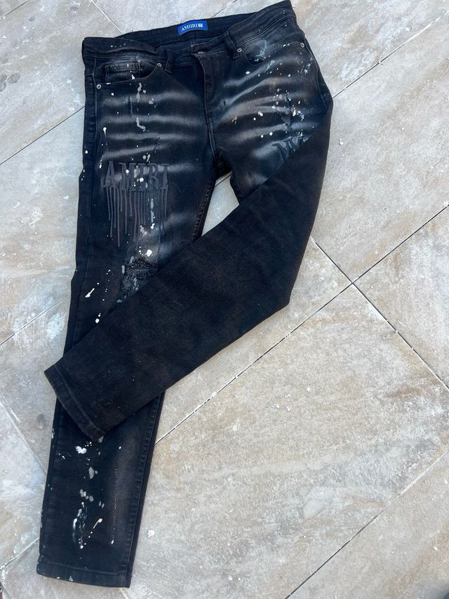 Vaqueros Amiri negros con salpicaduras