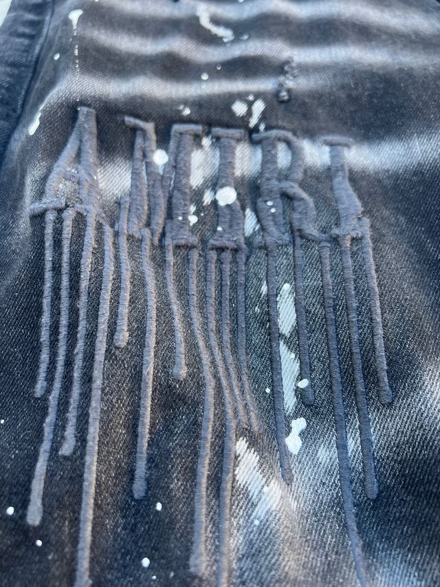 Vaqueros Amiri negros con salpicaduras
