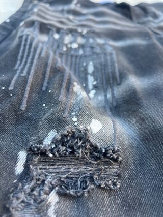 Vaqueros Amiri negros con salpicaduras