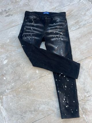 Vaqueros Amiri negros con salpicaduras