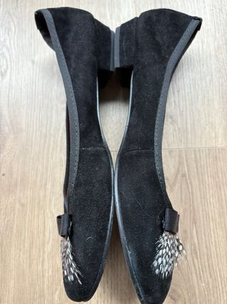 Bailarinas negras con lazo y plumas