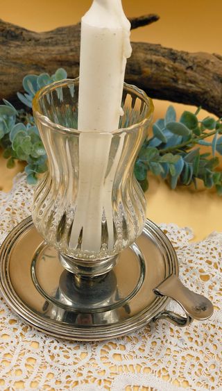 Bugia in metallo con lume in vetro