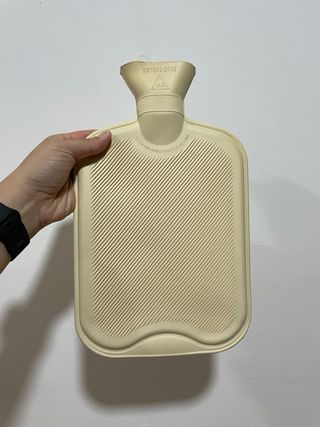 Bolsa de agua caliente con funda de peluche