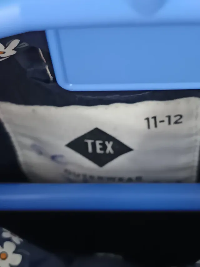 Chaleco infantil azul con flores