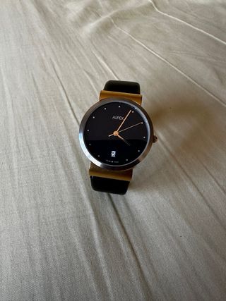 Reloj Alfex elegante negro y dorado