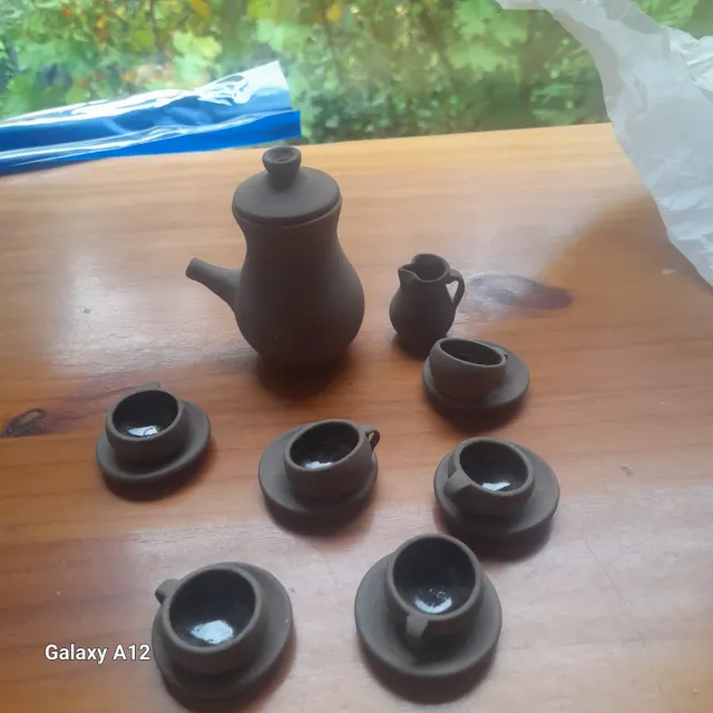 Juego de té miniatura de barro