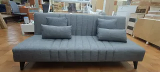 Sofá cama gris de tela