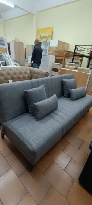 Sofá cama gris de tela