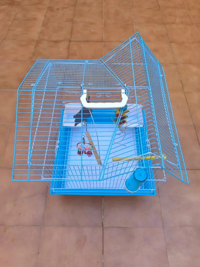 Jaula para pájaros azul con accesorios