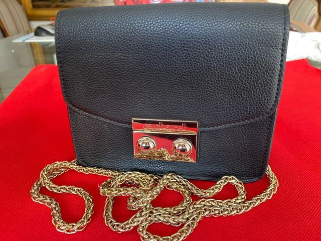 Bolso fiesta negro Cacharel con cadena dorada