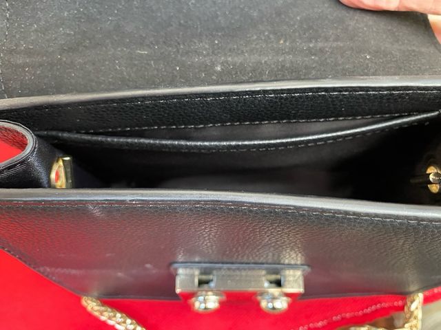 Bolso fiesta negro Cacharel con cadena dorada