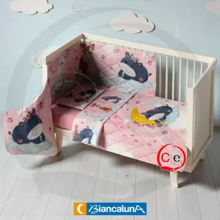 Trapunta e paracolpi per culla