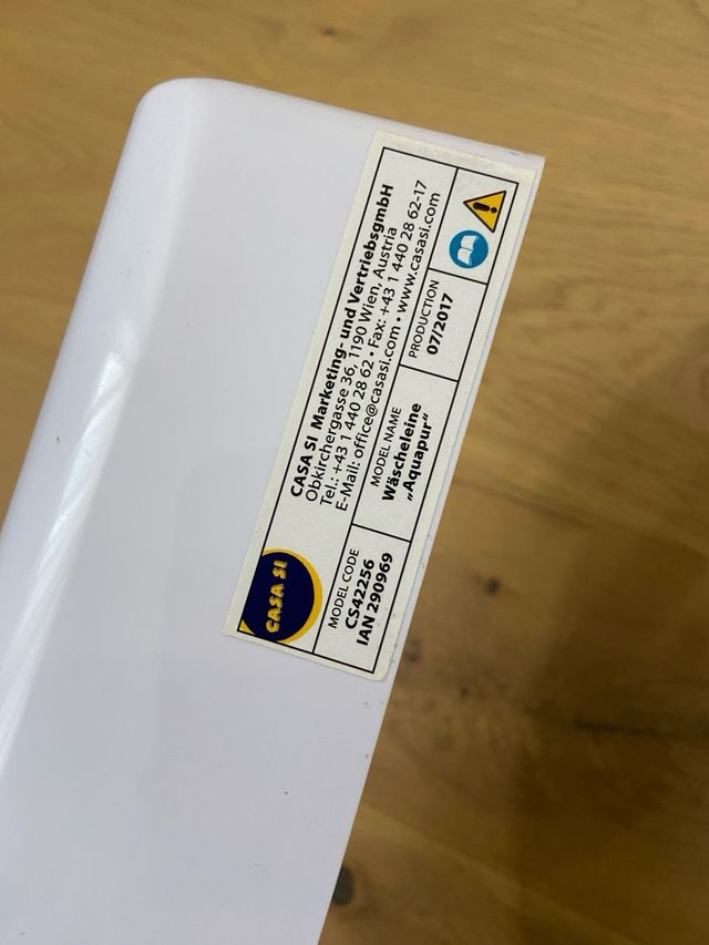 Tendedero extensible retráctil blanco