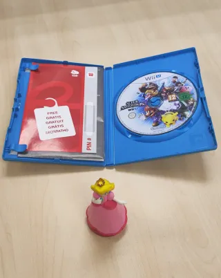 Juego Super Smash Bros Wii U + Amiibo Peach