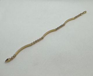 Pulsera Cartier y Barra de oro 18k, 6.91 g, 18 cm.