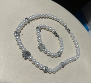 Conjunto de collar y pulsera de perlas