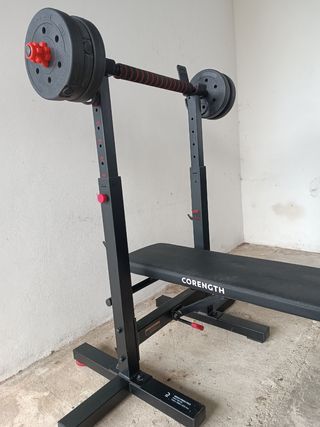 Banco de pesas con barra y discos