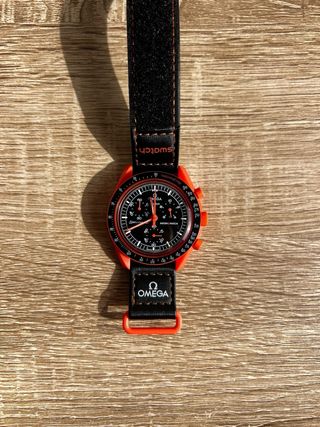 Reloj Swatch Naranja y Negro 