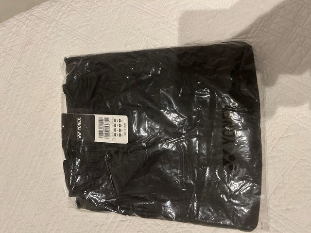 Pantalón deportivo Yonex negro y amarillo