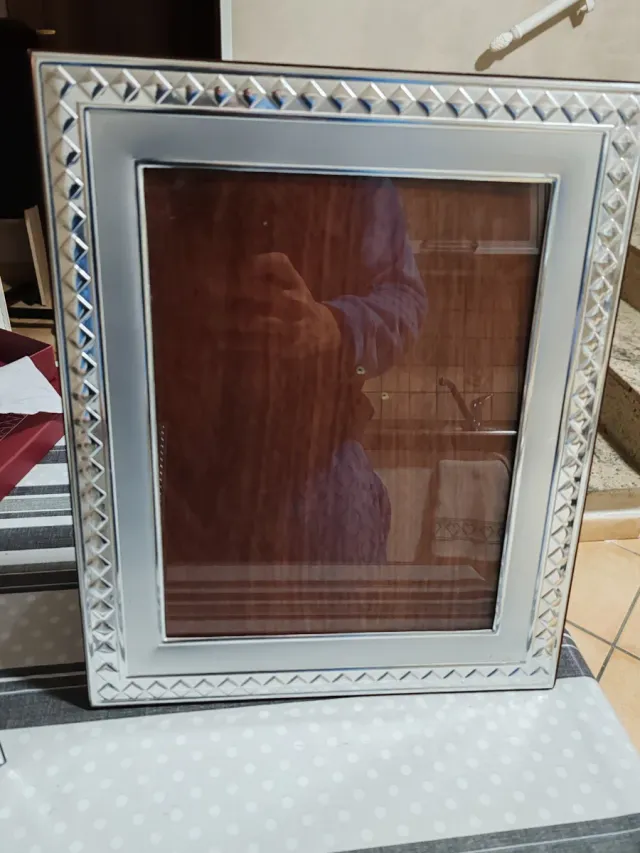 Cornici e sveglia d'argento 