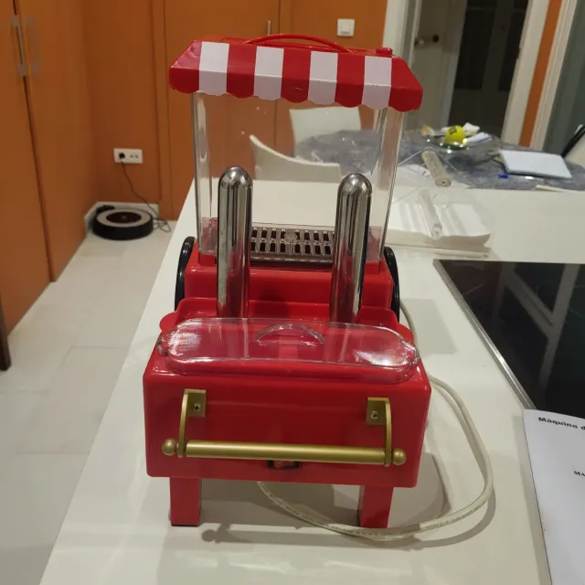 Máquina de perritos calientes con instrucciones.