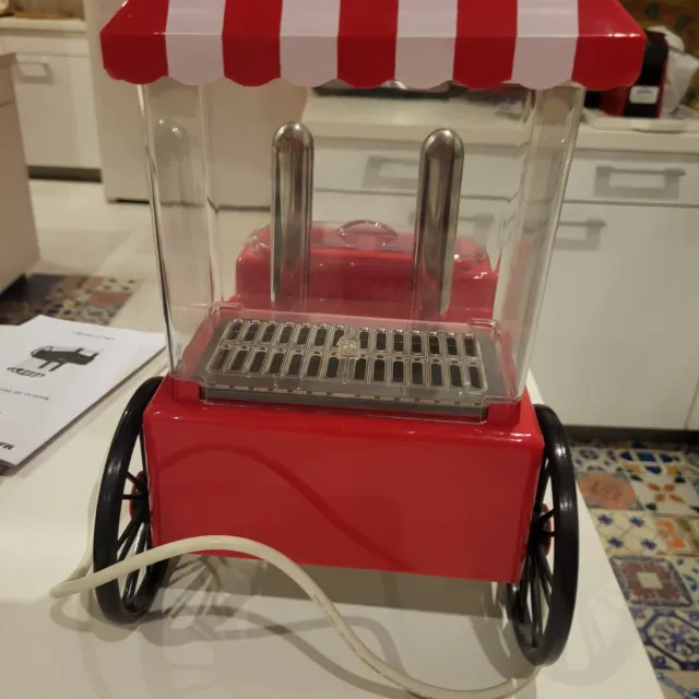 Máquina de perritos calientes con instrucciones.