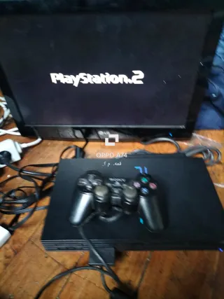Consola PlayStation 2 con mando y juego