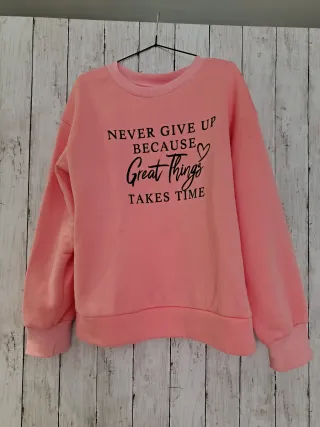 Sudadera rosa con mensaje