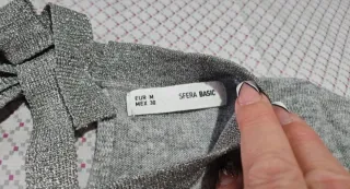 Jersey gris con lazo en espalda