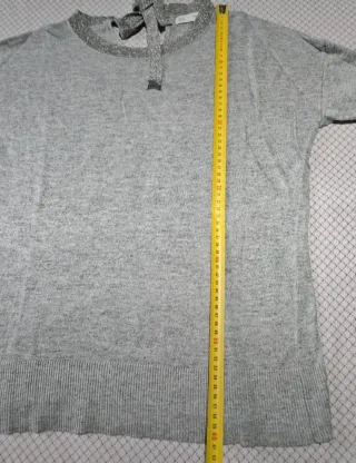 Jersey gris con lazo en espalda