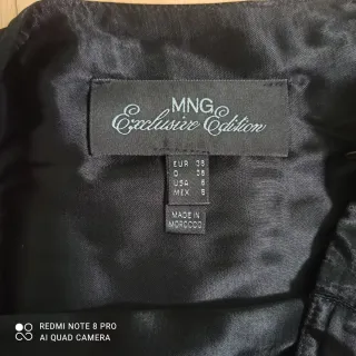 Falda midi Mango negra volantes