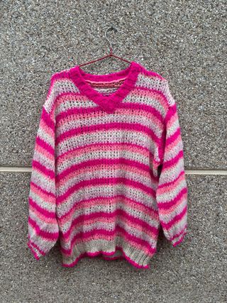 Jersey de punto rosa y dorado