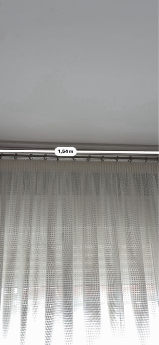 Cortinas salón con barras y cojines