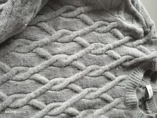 Maglione grigio trecce donna