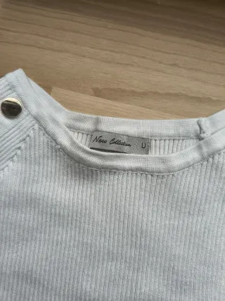 Jersey punto blanco con tachuelas doradas