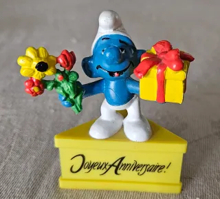 Puffo con regalo e fiori - anno 1980