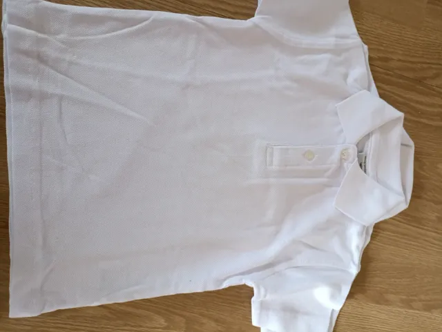 Polo unisex infantil blanco