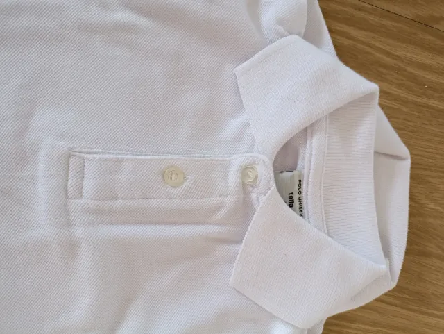 Polo unisex infantil blanco